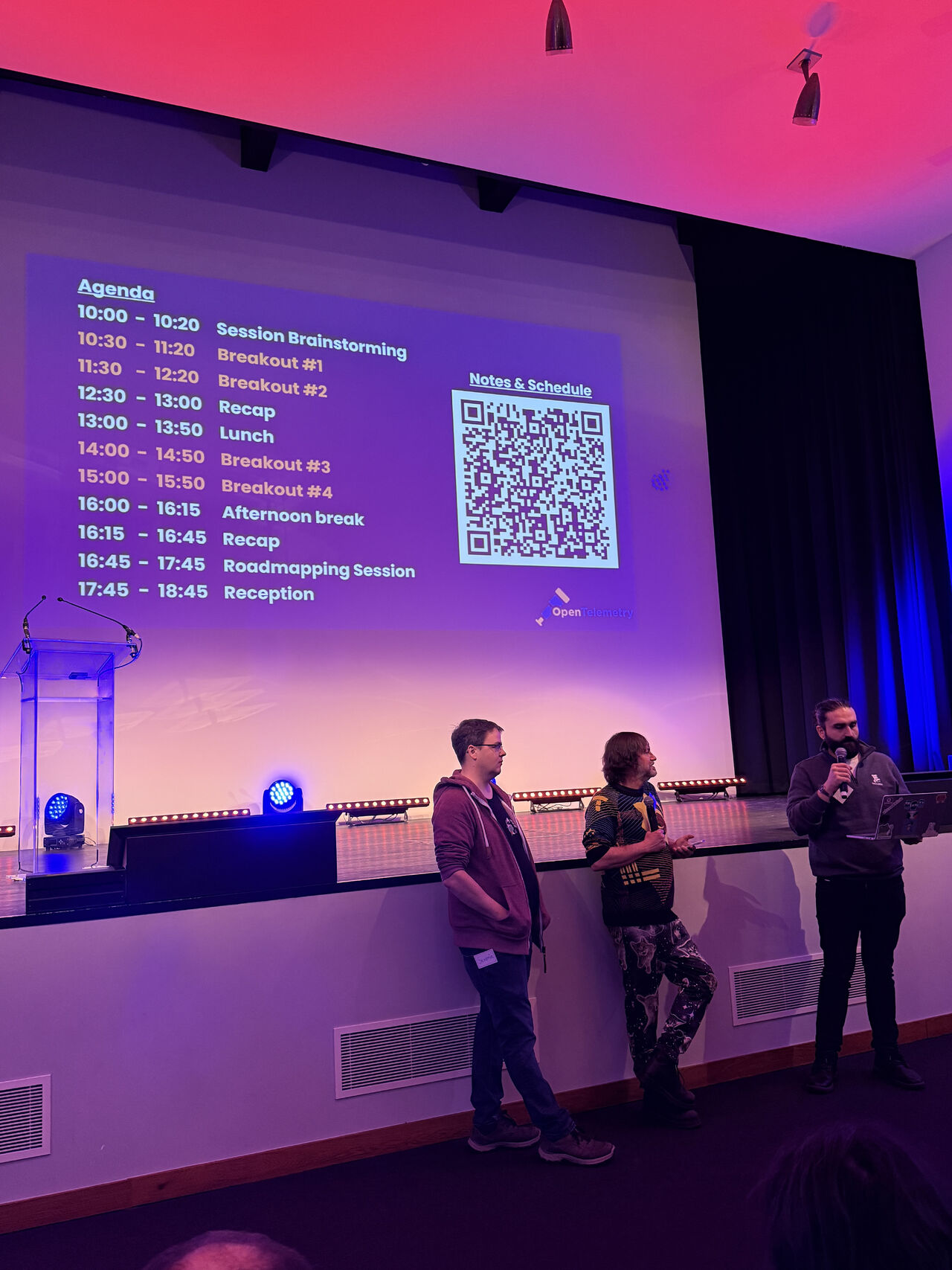 OTel Unplugged agenda projected on stage